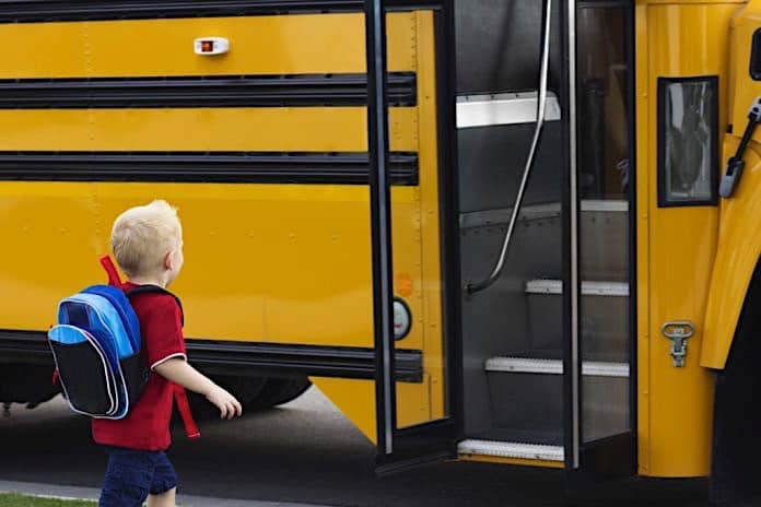 File photo of a child about to board a school bus.
