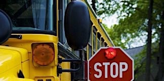 School bus with stop arm extended.