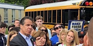 New York Gov. Andrew Cuomo and other officials rode a school bus to a press conference on Monday, June 11, 2018 to promote new legislation to improve student safety at schools.