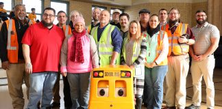 Recognized East Aurora, Illinois bus drivers pose with Buster the School Bus after a "Love the Bus" assembly held Feb. 8, 2019. (All photos are courtesy of ASBC.)