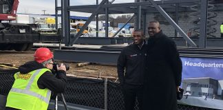 The father-son duo of Korey and Stephen Neal stand in front of the construction site of their new facility in Maryland.