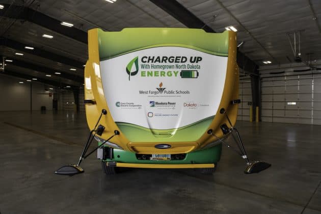 All Electric School Bus with sponsor names on it