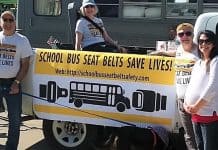 The School Bus Safety Alliance designed a colorful banner to help campaign for seat belts in school buses, at the Avon Lake Memorial Day Parade in Ohio. (Photo courtesy of cleveland.com.)