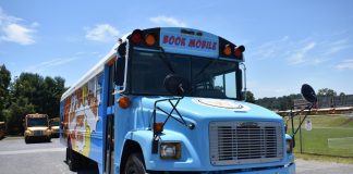 Washington County’s refurbished school bus gives students access to reading during the summer. (Photo courtesy of Herald & Tribune.)