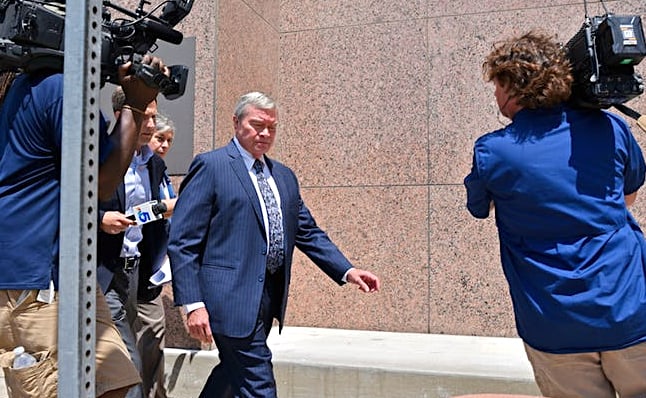 Rick Sorrells, the ex-superintendent of Dallas County Schools, exiting the federal courthouse in Dallas. He was sentenced to seven years in federal prison. (Photo capture from Dallasnews.com.)