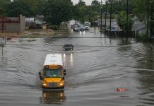 A school bus driving through flooded roads on Sept. 19 in Houston. Hurricane Imelda reportedly dumped 40 inches of rain in over 72 hours. (Photo: Thomas B. Shea/Getty Images.)