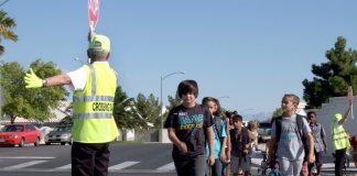 Clark County School District students in Las Vegas cross the street with the help of a crossing guard. (Photo courtesy of CCSD.)