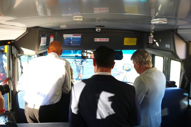 The bus driver (far left), with Young (center) and Brownley (far right).