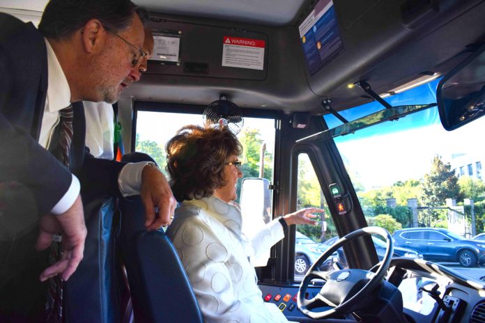 U.S. Sen. Gary Peters of Michigan (left) and Rep. Jackie Walorski of Indiana tried out the features of a school bus during a Capitol Hill event in 2019 that highlighted technology available to combat illegal passing.