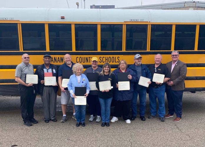 Transportation staff at Kanawha County Schools, West Virginia. From left: Jimmy Lacy, Willie Schofield, Billy Wiseman, Nancy Fields, Mary Slate, Tricia Jarrell, Laura Childress, Warren Reynolds, Wade Carnell, and Tommy Young of the state Department of Education.