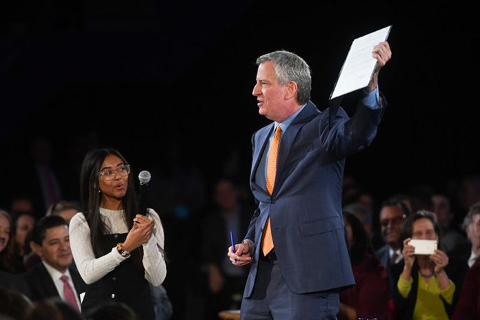 Mayor Bill De Blasio displays an executive order he signed during his State of the City address on Thursday, Feb. 6, 2020. (Photo courtesy of New York City Mayor’s Office.)