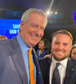 Mayor Bill De Blasio with Corey Muirhead, executive vice president for Logan Bus & Affiliates, at the State of the City event on Thursday, Feb. 6, 2020. Logan Bus is one of several dozen school bus contractors operating in the city.