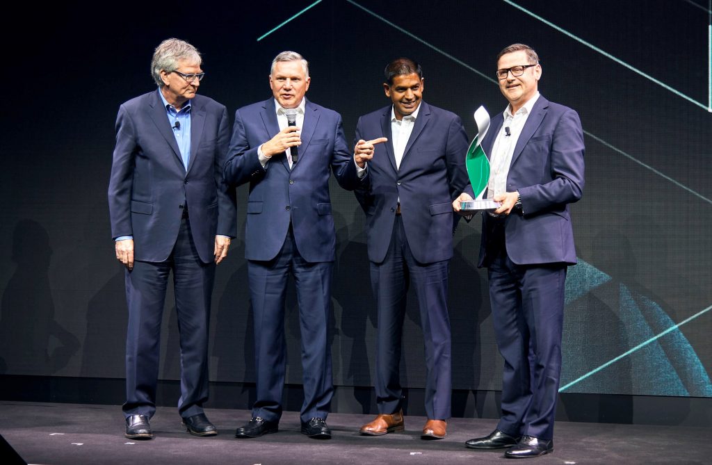 Daimler executives Martin Daum (left) and Marcus Schoenenberg (right) present the Daimler Supplier Award to Meritor’s Jay Craig, CEO and president (second from left) and Chris Villavarayan, executive VP/COO.