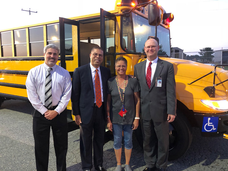 From left: Dr. Daniel Bowling, chief operations officer; Dr. Jeffery O. Smith; school bus driver; and school board member Joseph Kilgore. 