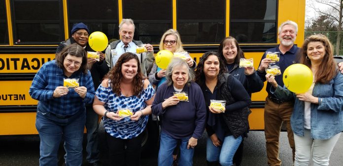 Marissa Plancher, (first row, second from left) used Love the Bus Month to show her transportation staff at Metuchen School District in New Jersey how much they mean to her.
