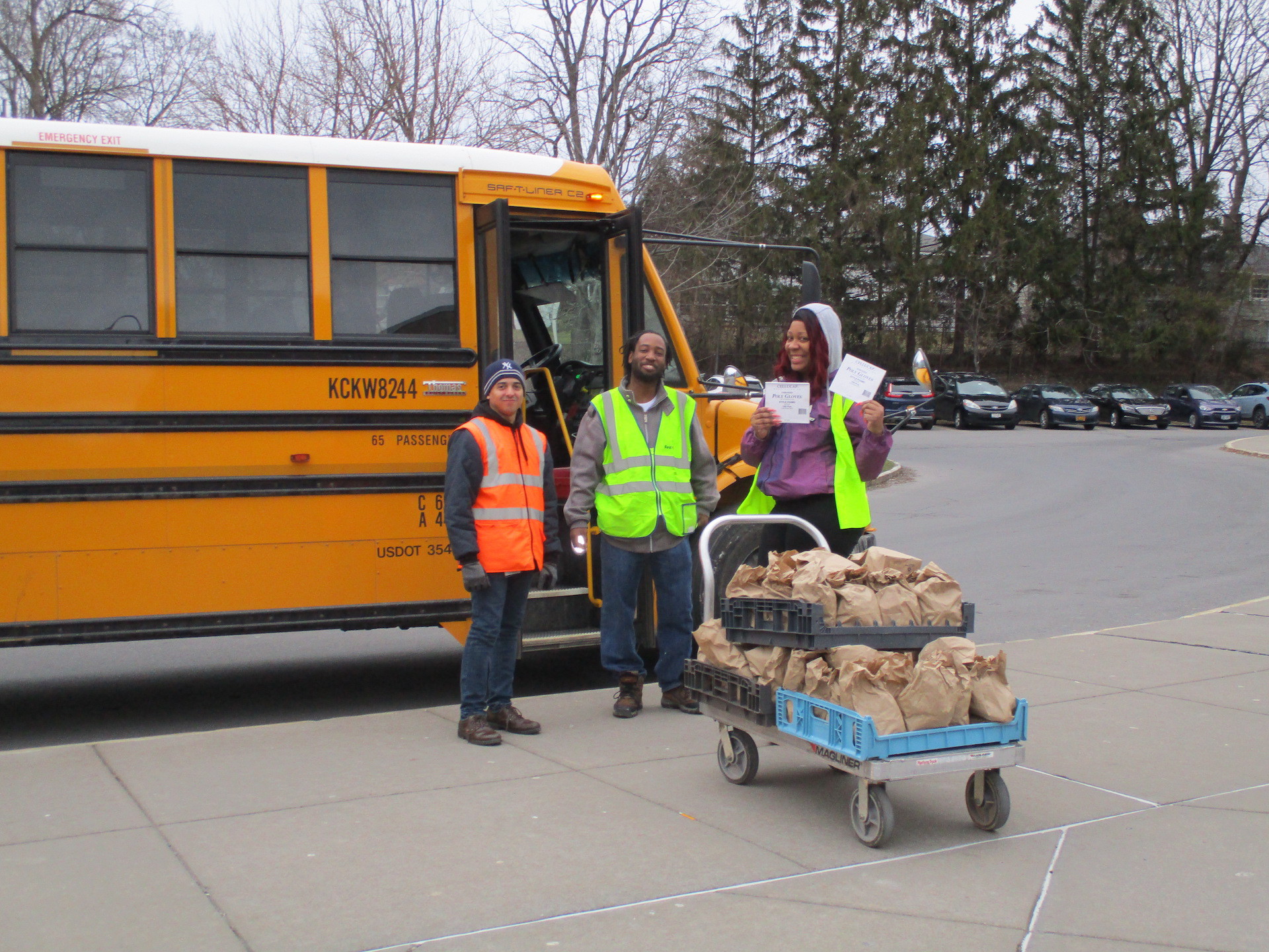 First Student school bus drivers in Syracuse, New York, deliver meals during the coronavirus pandemic.