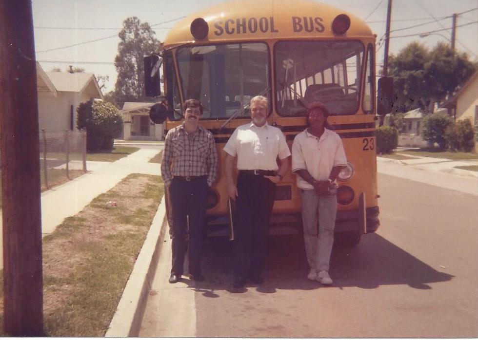 Tim Purivs (left) posing with of his two students while he was driver trainer at Fullerton Joint Union High School District in California.