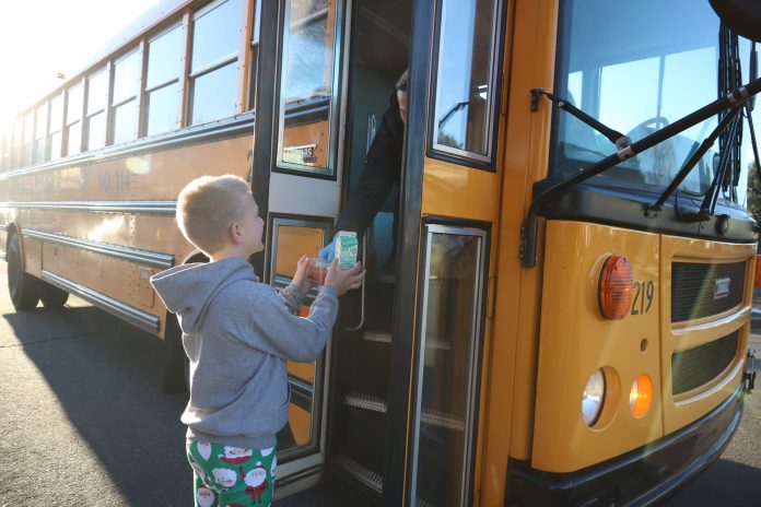 An Evergreen Public Schools bus in Washington state delivers a meal to a homebound student during COVID-19 closures.