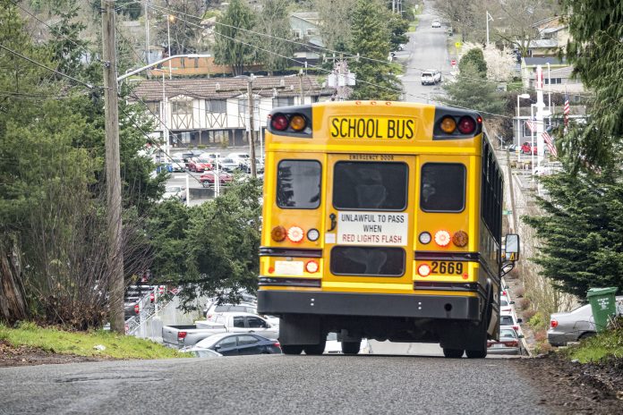 A school bus travels down a hill in Seattle.
