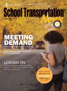 A parent checks the location of her child’s school bus. Cover by Kimber Horne.