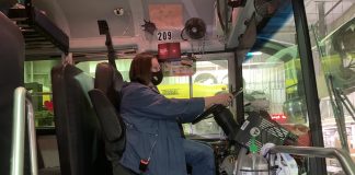 School Bus Driver Timarie Javier wears a face mask while sitting behind the wheel of a Campbell County School District bus in Gillette, Wyoming. The district started transporting students at the start of the 2020-2021 school year, with safety protocols in place to mitigate COVID-19 exposure.