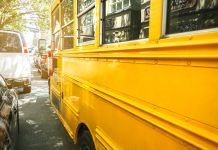 Closeup of classic yellow school bus parked on the street of New York City