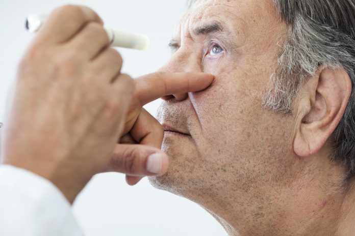 Elderly man examined by an ophthalmologist