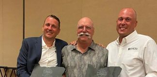 From left: Chase Schetky, co-owner of Schetky NW Bus Sales; Michael Shields, retired Director of Transportation from Salem-Keizer SD; and David Schetky, co-owner of Schetky NW Bus Sales received the 2020 Ron Bryan President's Award during the Oregon Pupil Transportation Association Conference. David and Chase accepted the award for their father, Randy Schetky, who died on April 3, 2020.