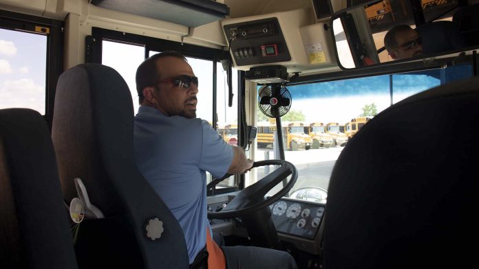 Director of Transportation Kayne Smith assigned himself a morning and afternoon route last school year due to the school bus driver shortage at Cy-Fair ISD in Houston. (Photo by Taylor Hannon.)