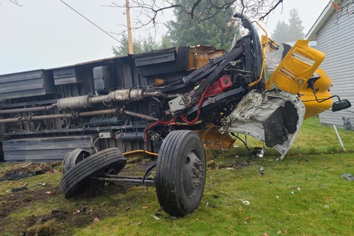 An East Valley School bus with no kids inside flipped over after a car crash in the Otis Orchards area of Spokane Valley on Monday morning, Nov. 22, 2021. Photo courtesy of the Spokane Valley Fire Department.