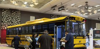STN EXPO Reno attendees visit the BYD exhibit on Dec. 8, 2021. The Chinese manufacturer is the latest to announce it is entering the electric school bus market. (Photo by Taylor Hannon.)