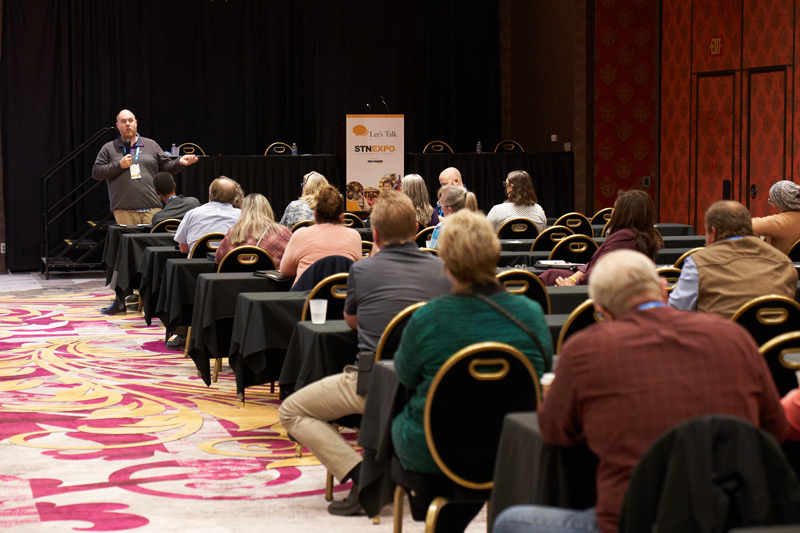 Ryan Hahn of Strategic School Consultants speaks to STN EXPO Reno attendees about bell time changes on Dec. 7, 2021. (Photo by Vincent Rios Creative)