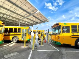 New electric buses charge at Modesto Unified School District in California.