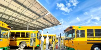 New electric buses charge at Modesto Unified School District in California.