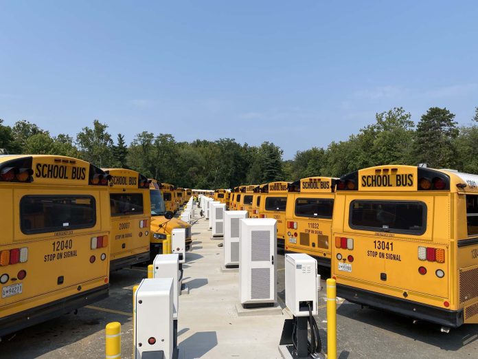 Electric buses and chargers at the Bethesda depot. (Photo courtesy of Highland Electric Fleets)