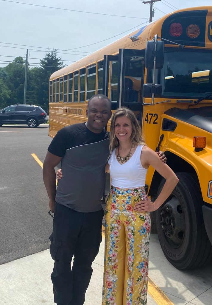 Elizabeth Fox, the director of transportation for Ithaca City Schools in New York, has committed to leading a department through a lens of Diversity, Equity and Inclusion, or DEI. She poses with employee Pedro Bieneme.