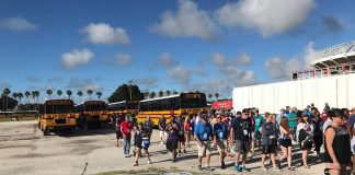 Families of 2022 Special Olympics USA athletes make their way from school buses to the games venue last week in Orlando, Florida.