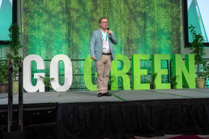 School Transportation News Publisher Tony Corpin announced five fleets that stood out for their goals to reduce emissions on July 17, 2022 during the Green Bus Summit at STN EXPO Reno. (All photos by Vincent Rios Creative.)