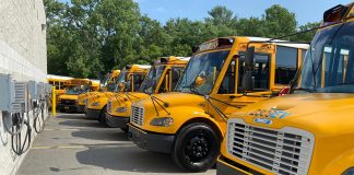 A row of five new electric Thomas Built Buses sit in their permanent parking spots at Bethlehem Central School District near Albany, New York, which received the vehicles on July 21, 2022 for the new school year.