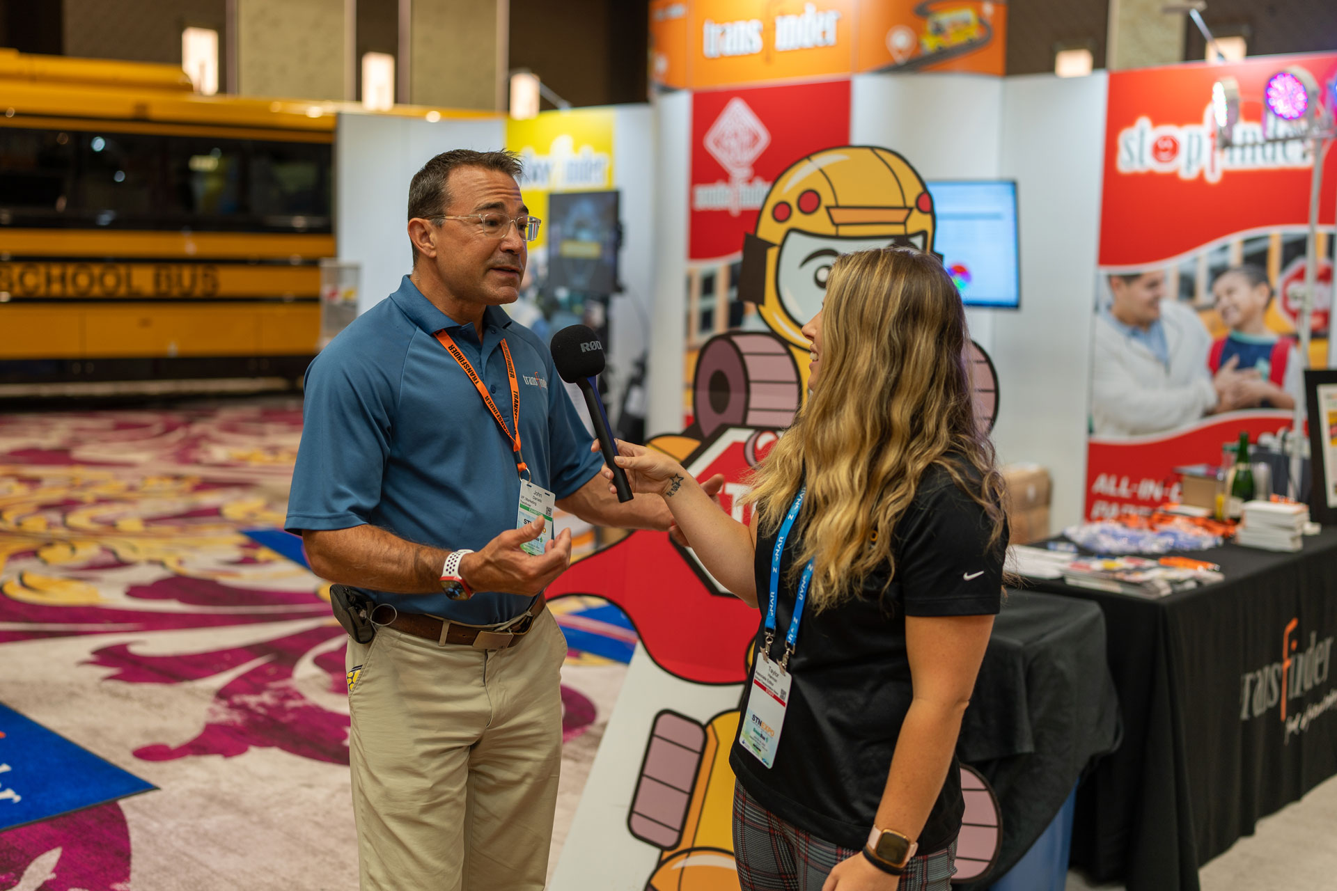 John Daniels, vice president of marketing for Transfinder, is interviewed by STN Associate Editor Taylor Hannon on July 19, 2022 during the STN EXPO Trade Show. The company won the "Best Software" category of the inaugural STN Innovation Choice Awards, as selected by attendees. (Photo by Vincent Rios Creative.)