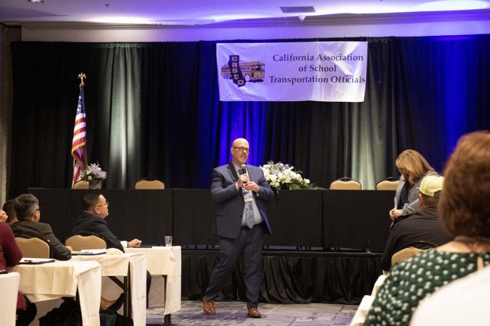 California Association of School Transportation Officials President Matthew Thomas speaking to attendees at the organization's Business Management Forum.