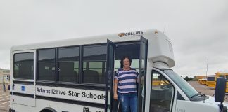 Driver Rhonda Coronado for Adams 12 Five Star Schools in Colorado poses in a non-CDL required vehicle. The district has leaned on the non-CDL program to keep transportation running smoothly amid the school bus driver shortage.