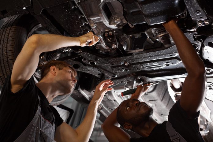 Stock photo showing two mechanic apprentices.