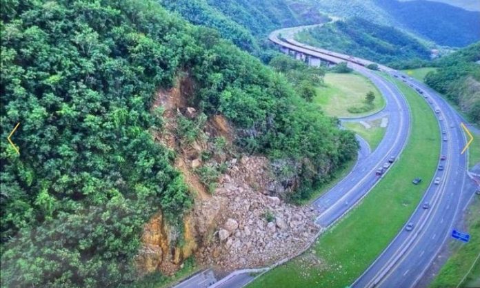 A landslide partially covers a road in Puerto Rico following Hurricane Fiona. (Photo courtesy of EL VIGÍA.)