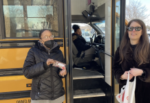 South Education Center staff Liz Rockler and an unidentified aide who works for Lake Country Bus help transport students from the Hopkins School District in the Minneapolis, Minnesota area.