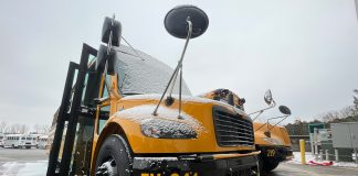 One of two electric school buses received by South Bend Community School Corporation in Indiana, plugged in on a snowy day. (Photo courtesy of South Bend Community School Corp.)