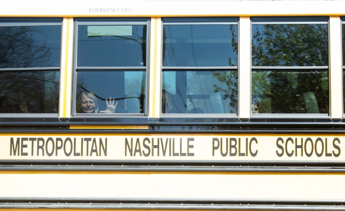 Student are transported to a reunification site via a Metropolitan Nashville Public Schools school bus following The Covenant School shooting in Nashville, Tennessee on March 27, 2023. Photo courtesy of Twitter/@USAToday, Nicole Hester.