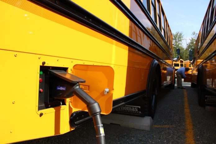 One of three electric buses at Highline Public Schools near Seattle, Washington, receives its charge.