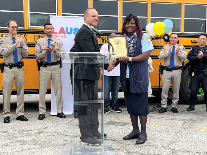 LAUSD bus driver Tamara Conley receives her award from the California Highway Patrol on May 9, 2023.