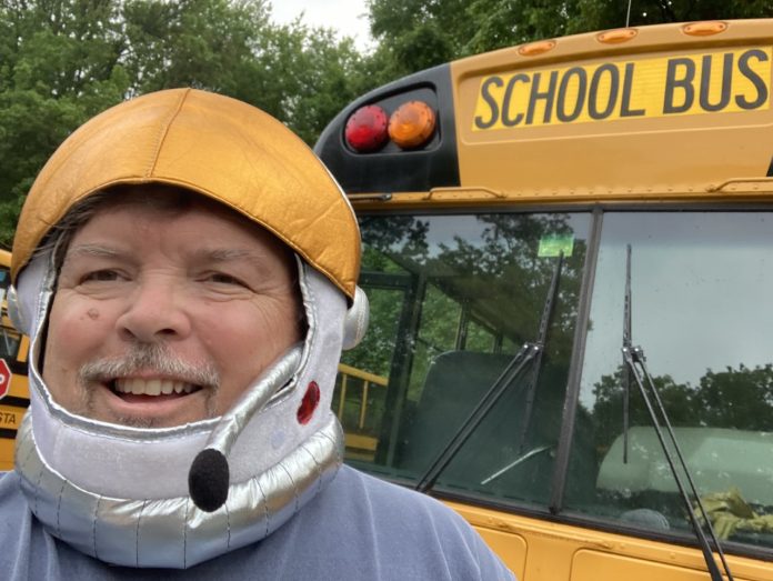 Students who ride Mike Eastland's school bus have extra reasons to look forward to Fridays, so they can see what kind of zany hat he'll be wearing behind the wheel.